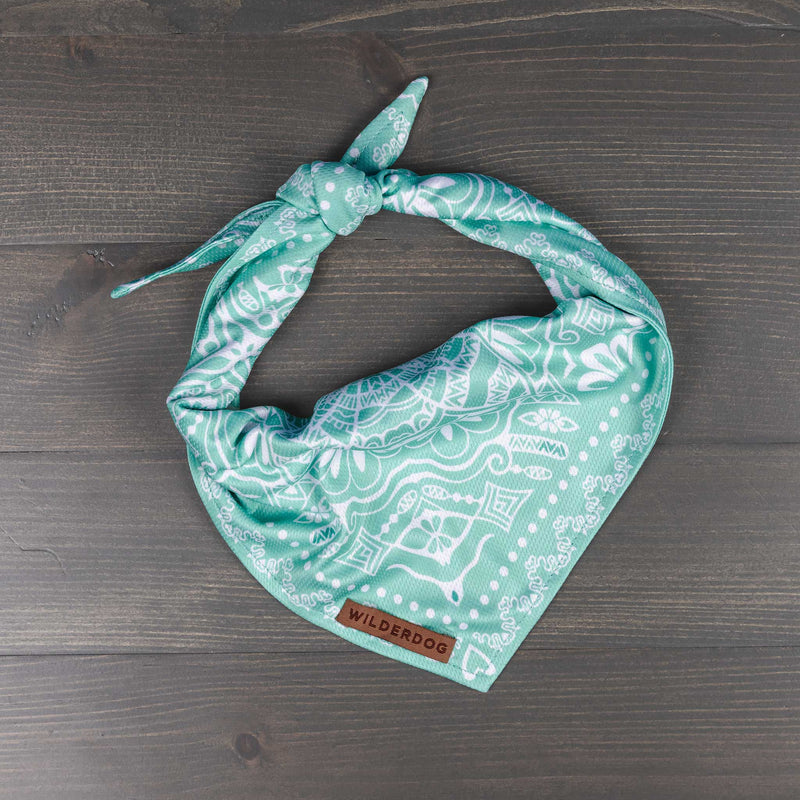 Teal and white Agave Bandana with intricate designs and Smartcart21 tag on gray wooden surface.
