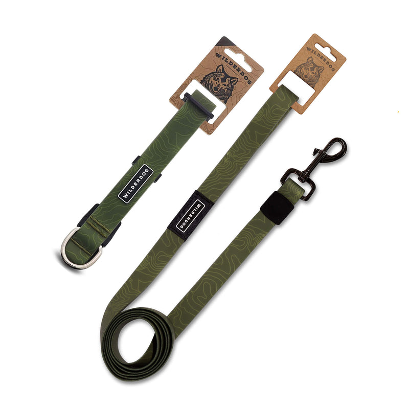 The Olive Waterproof Leash + Collar Bundle includes a green waterproof collar with metal D-ring and a stink-proof leash with metal clip. Both feature black & white Smartcart21 labels and eco-friendly cardboard packaging.