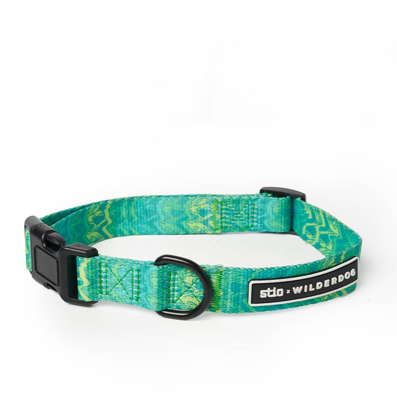 Introducing the Smartcart21 x Stio Ultralight Collar: a vibrant green and turquoise dog collar crafted from durable, lightweight nylon webbing with striking zigzag patterns. It features a sturdy black plastic buckle, a metal D-ring for easy leash attachment, and a sleek black tag with "sto x Smartcart21" branding.