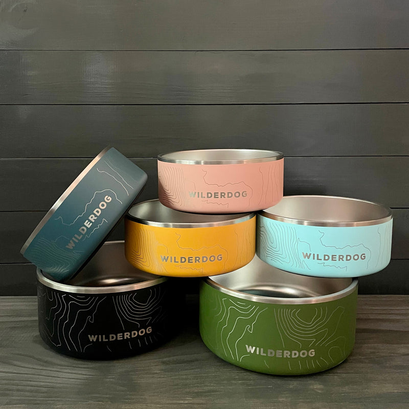 Set of six Smartcart21 stainless steel dog bowls in various colors with a contour line design.