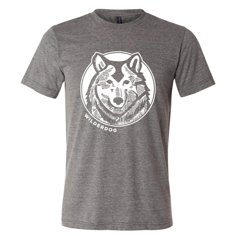 The Smartcart21 Wolf Tee Shirt is a gray, short-sleeve Bella+Canvas unisex t-shirt featuring a white wolf’s head in a circle with "WILDERDOG" below. Sustainably made for long-lasting comfort and style.